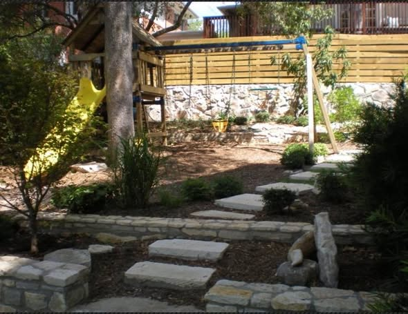 Layered garden path with native stonework and a shaded backyard retreat